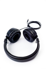 Wired headphones, black, with soft inserts, great sound, shot on a white background