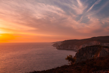 Coastal landscape with colorful dramatic sunset