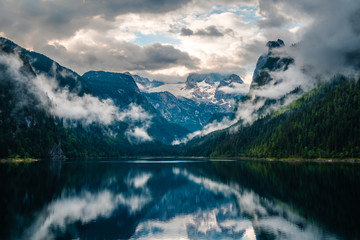 Beatiful view over the Gosau see in Austria towards Dachstein mountain, during fall with cloudy weather over the mountains