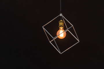 Modern ceiling light bulbs lamp made of brass metal frame geometric shape interior with black background decoration
