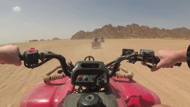 quad bike rides through the desert, action cam view