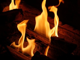 Close up of Hot tongues of flames from logs burning in a fireplace