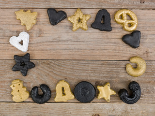 many different nice christmas cookies on wooden background photo taken from above