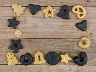 many different nice christmas cookies on wooden background photo taken from above