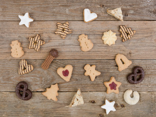 many different nice christmas cookies on wooden background photo taken from above
