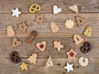 many different nice christmas cookies on wooden background photo taken from above