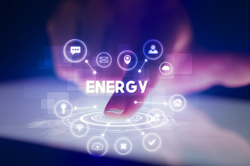 Finger touching tablet with web technology icons and ENERGY inscription, web technology concept