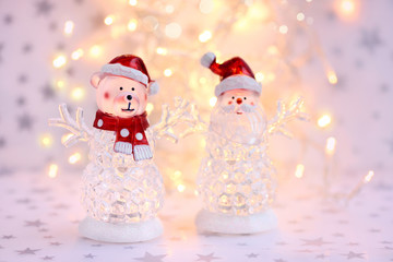 Christmas background with Christmas toys on festive lights background