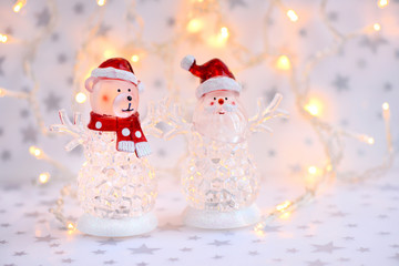 Christmas background with Christmas toys on festive lights background