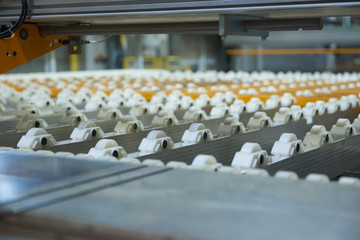 An empty industrial roller conveyor belt in a fully automated factory. roller conveyor to easily move heavy industrial goods around without the need for humans.future of industrial manufacture.