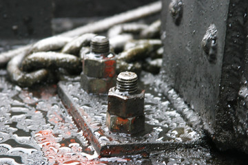 Steam locomotive details on a rainy, snowy day