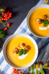 Delicious pumpkin soup with croutons and coconut milk