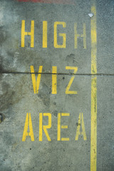A high viz area floor sign protecting workers in an industrial factory setting. Signs and notification hazard displays keeping people safe from work place hazard and injury. alerting danger.