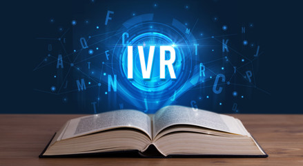 IVR inscription coming out from an open book, digital technology concept