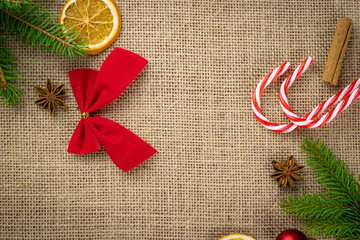 Happy New Years Day. Christmas celebration pattern. Gold Xmas decorations isolated on linen texture background.Banner mock up for display of product or design content