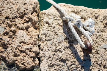 dock rope holder on rocks