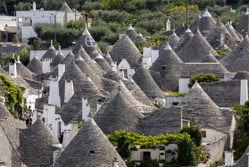  Tradtional white houses in Trulli village. Alberobello, Italy. 