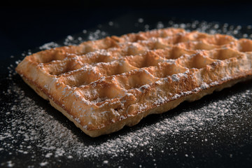 waffle sprinkled with powdered sugar