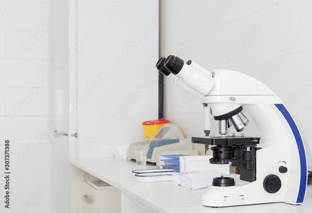Poster Close up of modern microscope on table with samples
