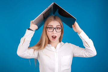 blonde girl in glasses with a laptop on her head