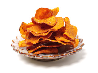 Stack of beet potato chips on white background