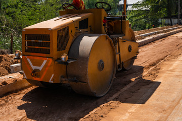 Road rollers working on the new roads construction site. Heavy duty machinery working on highway. Construction equipment. Compaction of the road.
