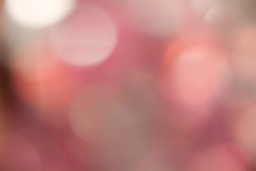 Abstract red-gray bokeh, bright background, blur.Bright light spots.