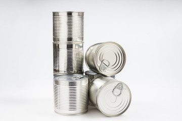 Group of silver canned food on white background.