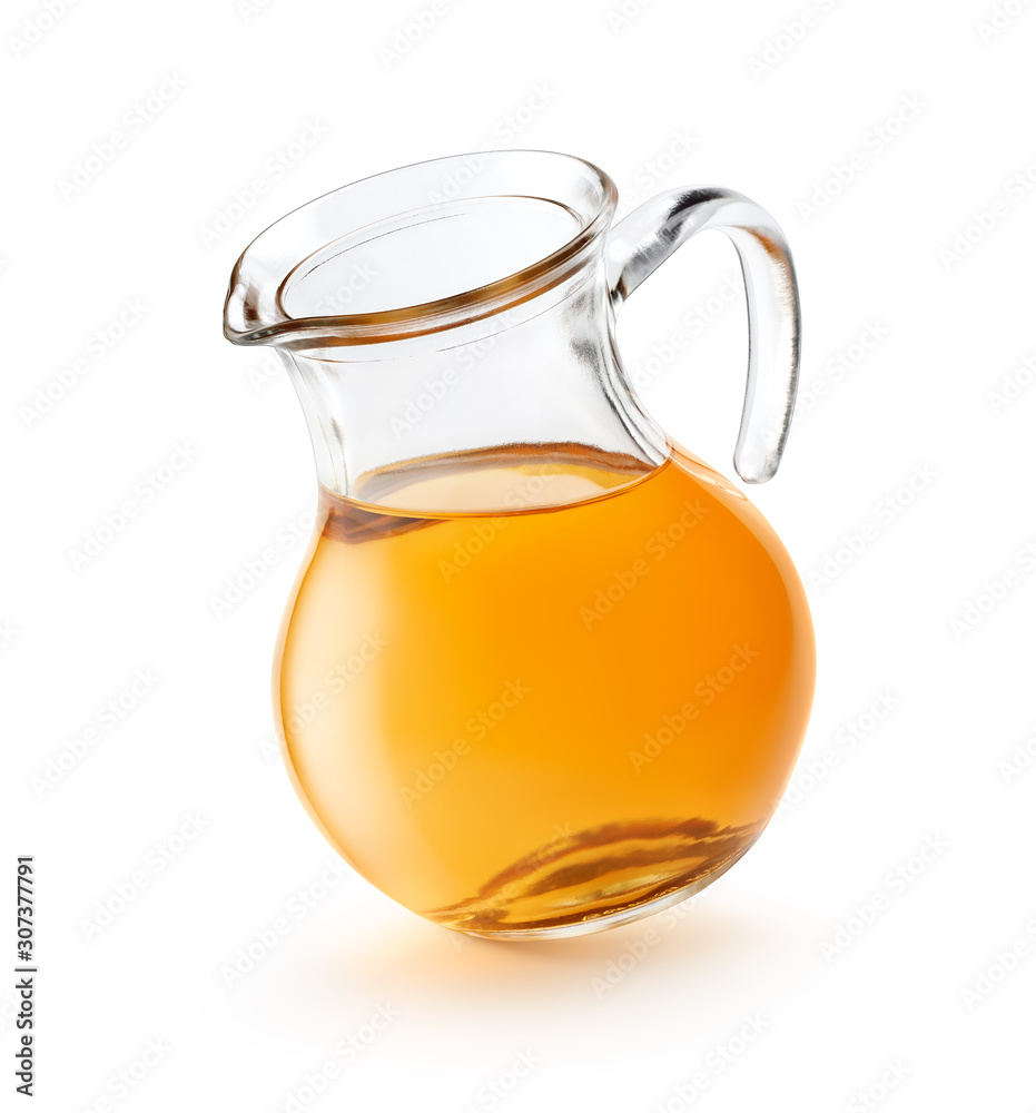 Wall mural apple juice in a pitcher isolated on white background