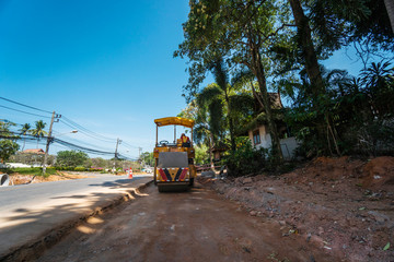 Road rollers working on the new roads construction site. Heavy duty machinery working on highway. Construction equipment. Compaction of the road.