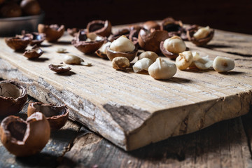 Fototapeta na wymiar Organic Macadamia nut on wooden