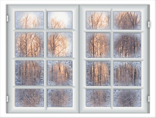 the window is covered with ice frost