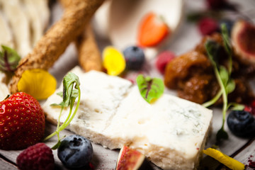 Cheese platter for two served on a plate in restaurant