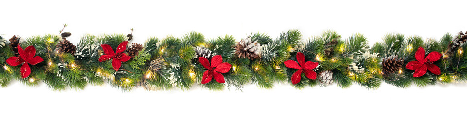 Christmas tree garland decorated with red christmas poinsettia flowers and shiny led lights, festive banner