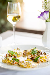 ravioli with mushrooms in a creamy sauce