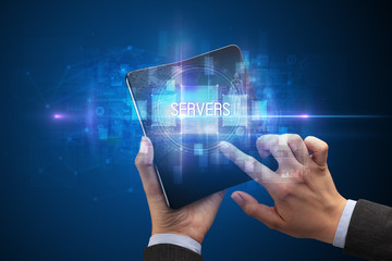 Businessman holding a foldable smartphone with SERVERS inscription, new technology concept