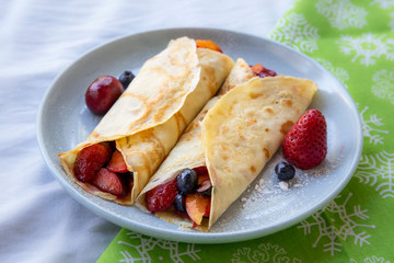 Crepes with Fresh Berries, Chocolate Sauce and Powdered sugar