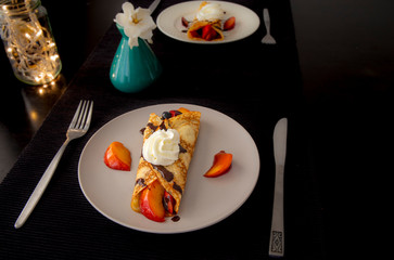 Crepes with Fresh Berries, Chocolate Sauce and Powdered sugar