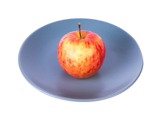 Perfect red apple on plate isolated on white background. Juicy and fresh apple for ads