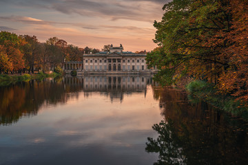 Fototapeta premium Royal Palace on the Water in Lazienki Park at autumn in Warsaw, Poland