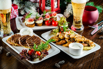 Christmas dinner, a table with festive dishes, food in plates on the table
