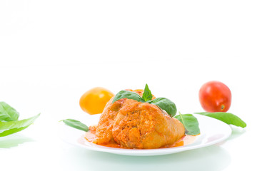 stuffed pepper with meat and vegetable sauce in a plate