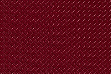 burgundy leather background with imitation weave texture. Glossy dermantine, artificial leather...