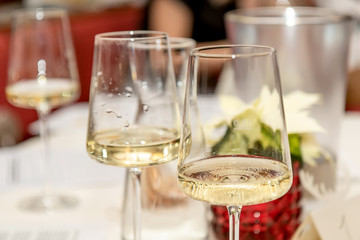Glasses of white wine on the table