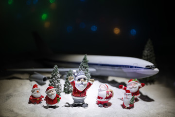 Merry Christmas and Happy new years travel concept background for winter trip on wood background , Travel with airplane top view with copy space.