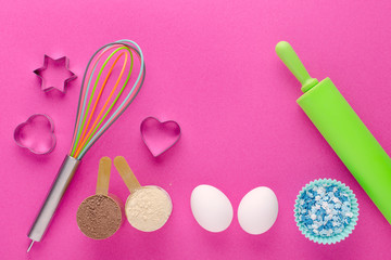 baking protein, eggs and kitchen tools with cookie cutter on pink background