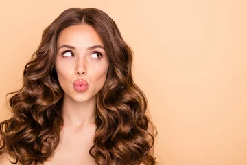 Fotobehang Close-up portrait of her she nice-looking attractive sweet gorgeous girlish curious wavy-haired girl looking aside sending kiss pout lips copy space isolated over beige pastel color background © deagreez