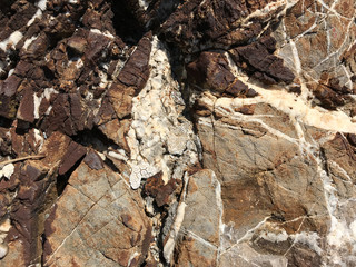 Colored layers of marble, background, stone texture.