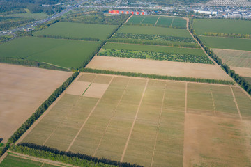 cultivated fields for agriculture near the city and city junctions. Russia, Moscow.