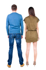 Back view of couple. beautiful friendly girl and guy together.